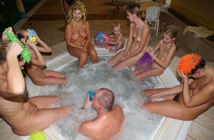 Nudists rest in a big company photo | Naturist Gallery